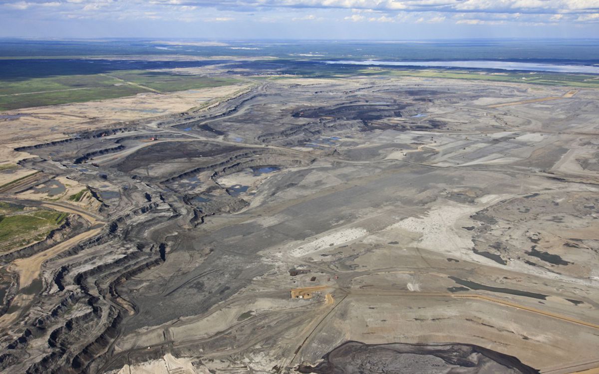 Open pit bench mining at an oil sands operation near Fort McMurray, Alberta.