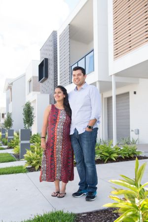 Fairwater development residents Sid and Nimarta Banga in front of their new home.