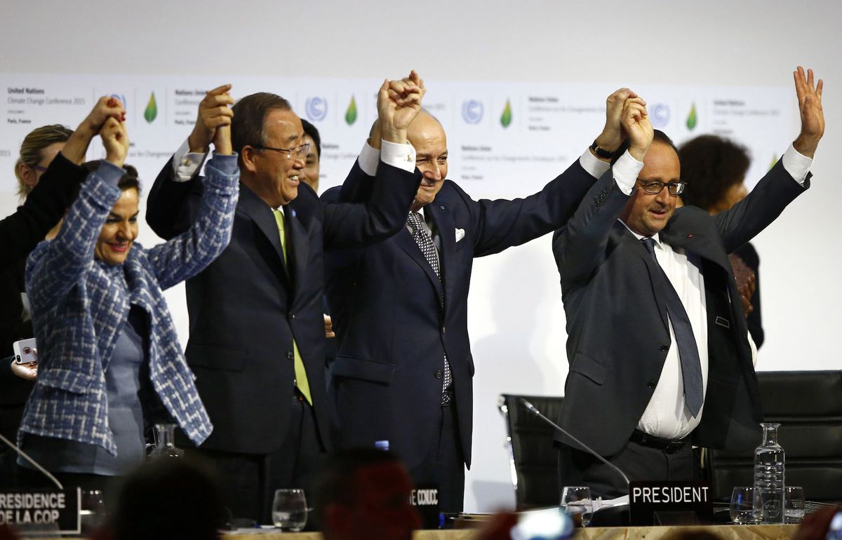 Officials celebrate the adoption of the Paris Climate Agreement in Le Bourget, France in Dec. 2015.