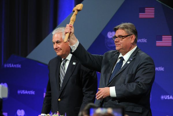 U.S. Secretary of State Rex Tillerson passes the official Arctic Council gavel to the Minister of Foreign Affairs of Finland, Timo Soini, in a ceremony Thursday at the Carlson Center in Fairbanks marking the passage of&nbsp;the chairmanship of the council from the United States to Finland.&nbsp;(Bob Hallinen / Alaska Dispatch News)