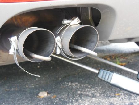 To measure pollution from tailpipes, Frey uses a small probe, which shuttles pollution samples to the PEMS system.