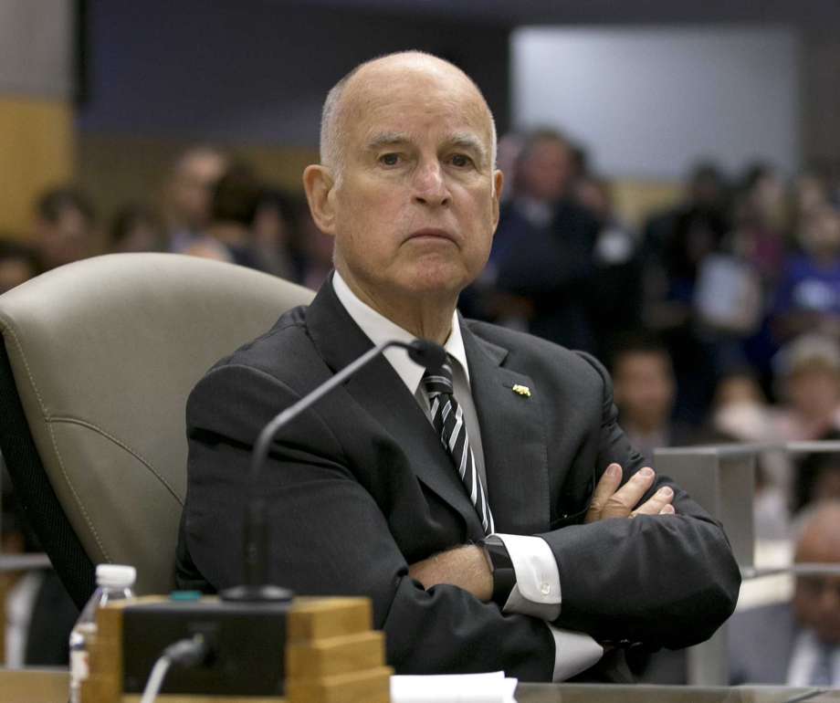 FILE -- In this July 13, 2017 file photo California Gov. Jerry Brown listens as members of the Senate Environmental Quality Committee discuss a pair of climate change bills he supports, in Sacramento, Calif. As his fourth and final term winds down Brown will spend the final 17 months in office working on California's housing crisis and fighting for ambitious projects to build a high-speed rail system and re-engineer California's water system. Photo: Rich Pedroncelli, AP / FILE