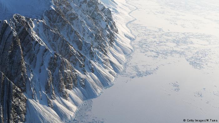 Sea ice (R) is seen from NASA's Operation IceBridge research aircraft on March 29, 2017 above Ellesmere Island, Canada.
