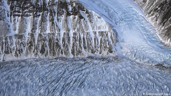 Ice is beginning to melt on a glacier along the Upper Baffin Bay coast above Greenland.