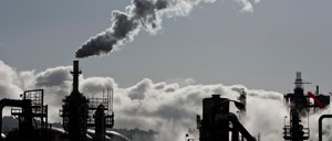 Smoke is released into the sky at an oil refinery in Wilmington, California