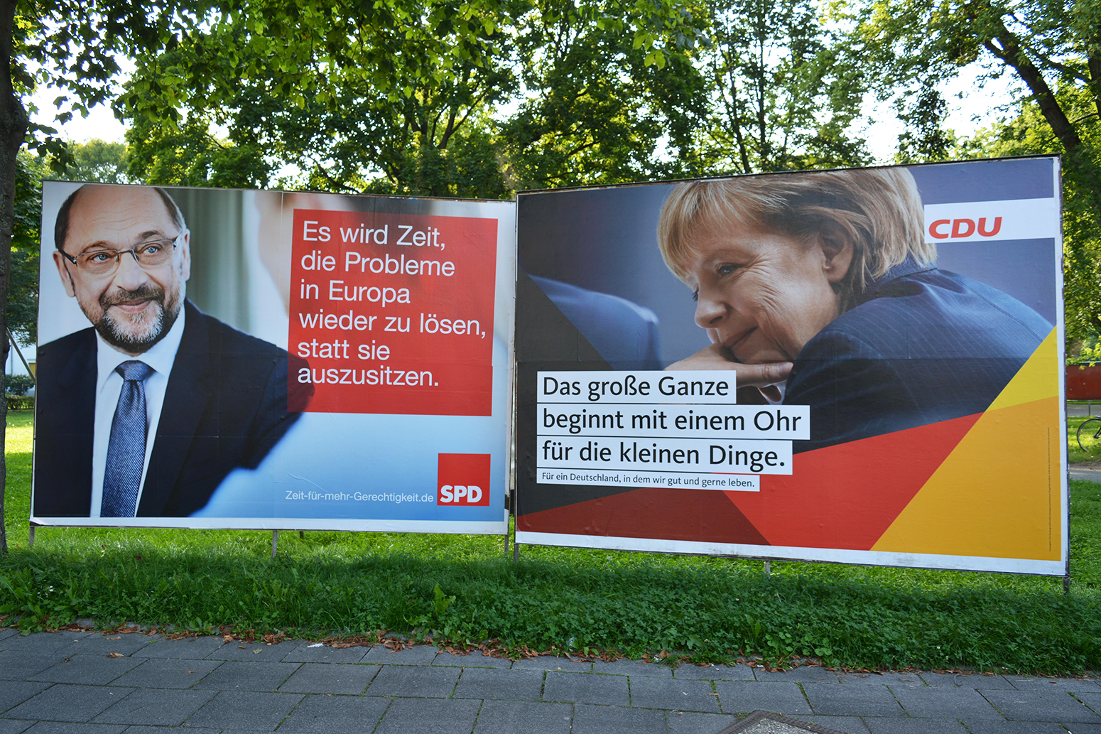 Two rival adverts for candidates in Germany's 2017 election