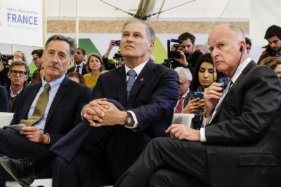 Washington Governor Jay Inslee (center) flanked by then-Vermont Governor Peter Shumlin (left) and California Governor Jerry Brown at the Paris climate summit in 2015.