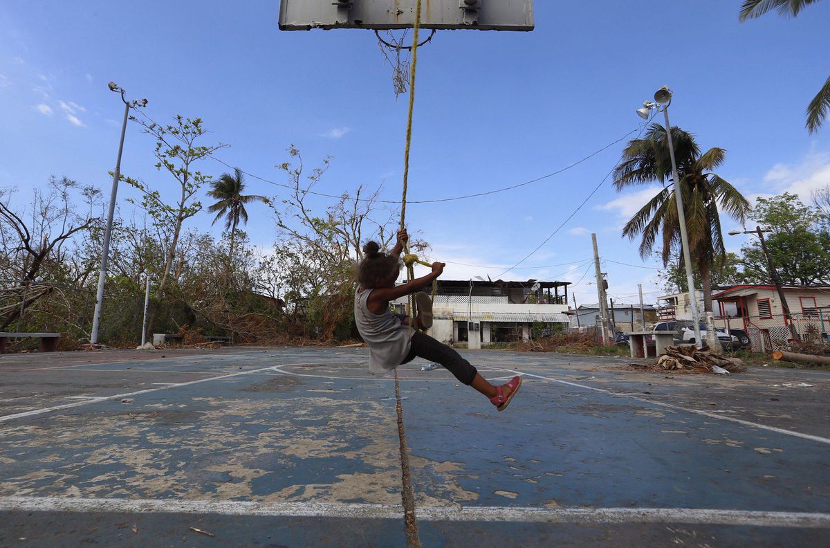 A girl plays in the aftermath of Hurricane Maria, at the neighborhood Obrero of Santurce district, in San Juan, Puerto Rico, Oct. 6, 2017.