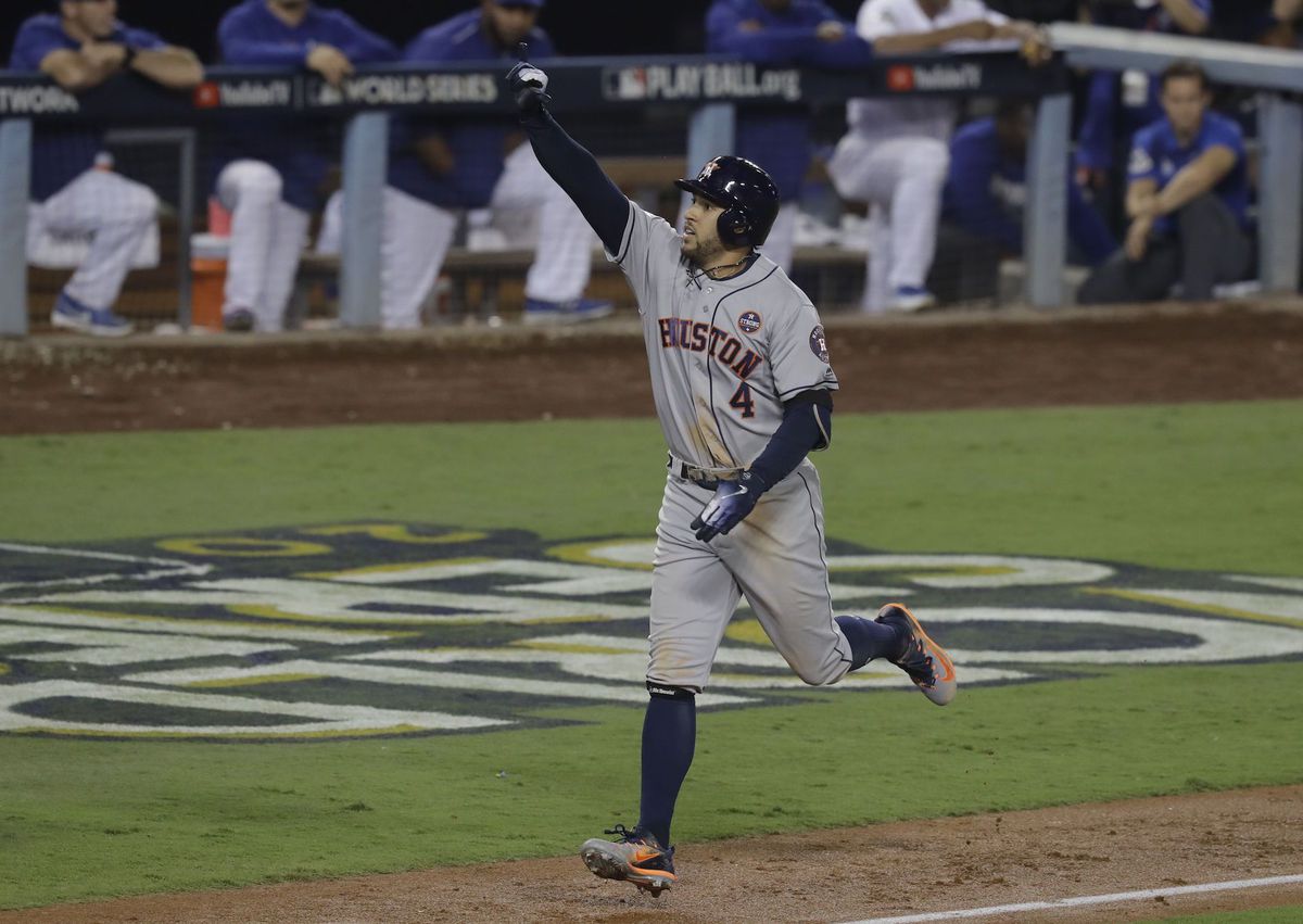 Houston Astros' George Springer celebrates after hitting a two-run home run.