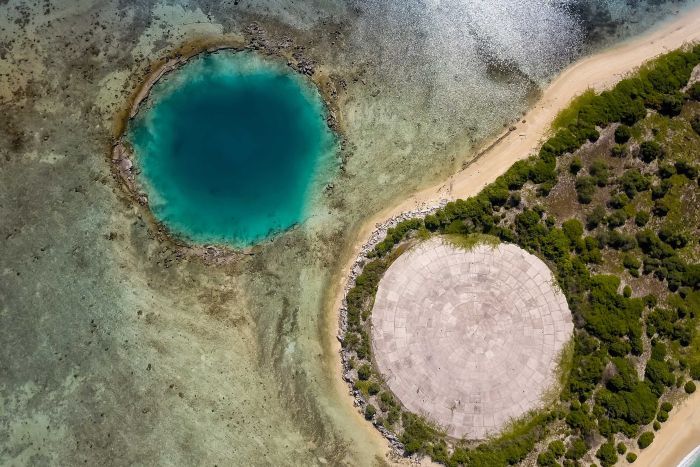 The dome and a water-filled crater left over by a nuclear bomb test.