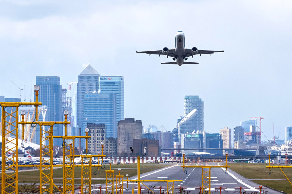 A plane takes off at London City Airport, UK. Credit: Marcin Rogozinski / Alamy Stock Photo. M6G8K5