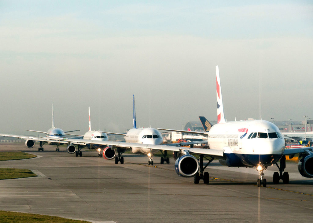 Planes queuing for takeoff at Heathrow airport, UK. Credit: david pearson / Alamy Stock Photo. BWTNWE