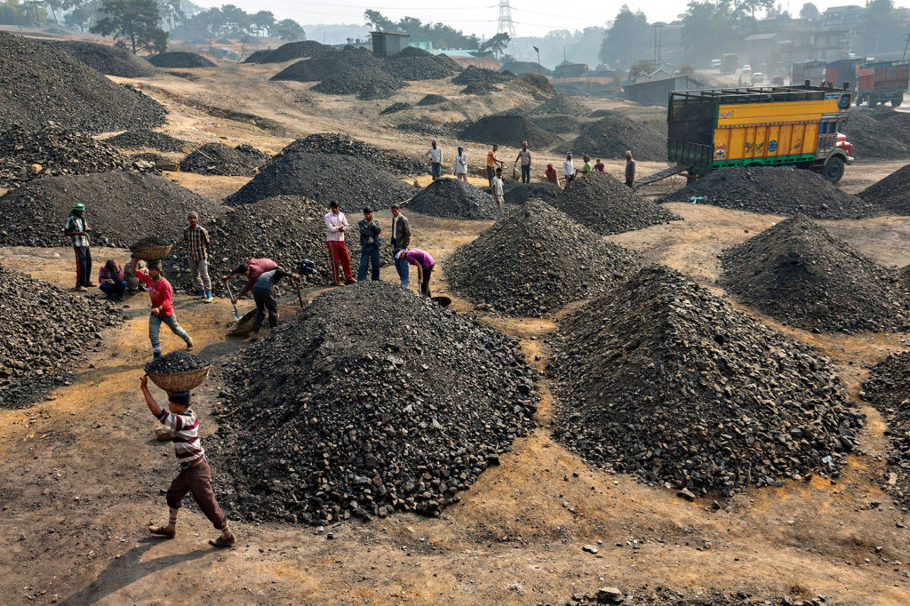 Coal being sorted by size and quality, Meghalaya, India. Credit: National Geographic Image Collection / Alamy Stock Photo. EB4DH0