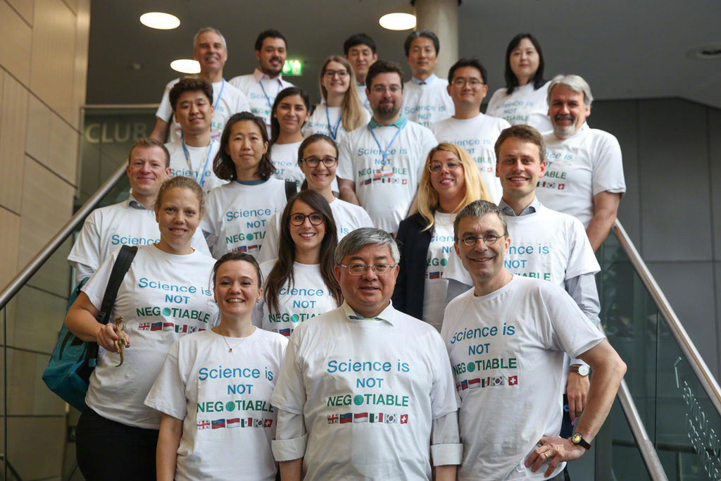 Members of the Environmental Integrity Group arrived at the closing plenary in T-shirts saying &ldquo;science is not negotiable&rdquo;. Photo by <a target="_blank" href="http://enb.iisd.org/climate/sb50/images/27jun/ENB_SB50_27June19_KiaraWorth-19.jpg">IISD/ENB | Kiara Worth</a>
