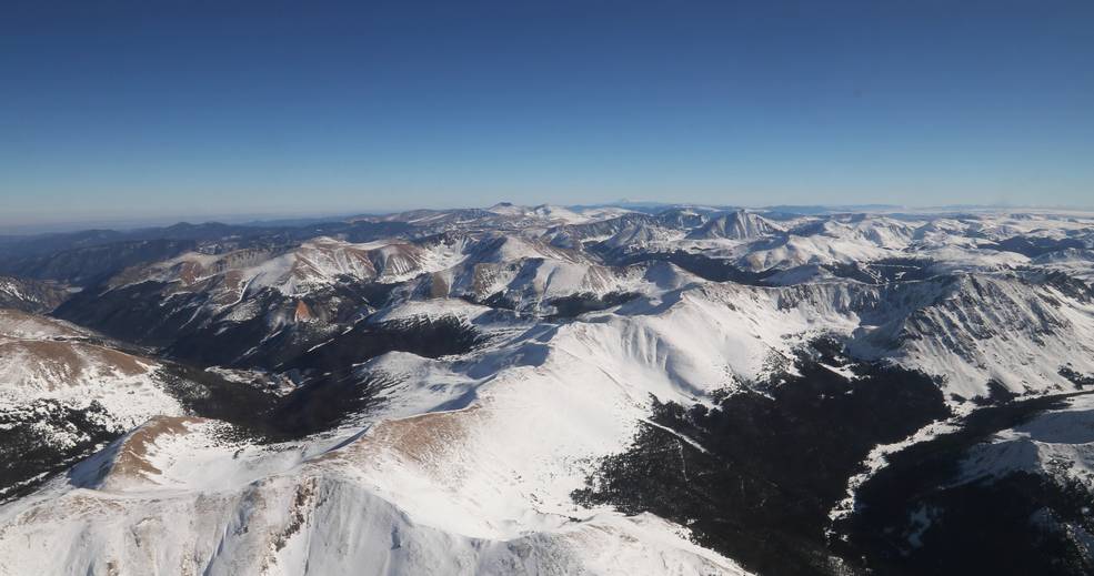 snow-capped mountain landscape against the backdrop of a clear blue sky