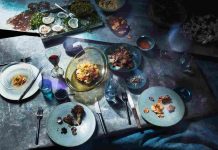 Artist sets futuristic dinner party in world reshaped by rising seas.