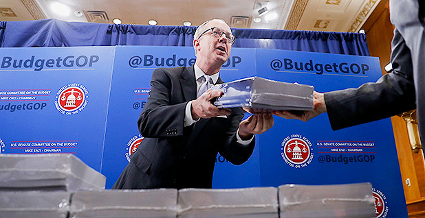 Eric Ueland distributes copies of President Trump&rsquo;s fiscal 2018 budget 