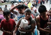 Florida’s migrant farm workers struggle after hurricane damaged homes, crops.