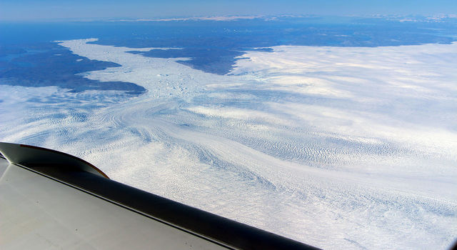 slide 2 - A wider view of the calving front of Jakobshavn from the window of a NASA research plane