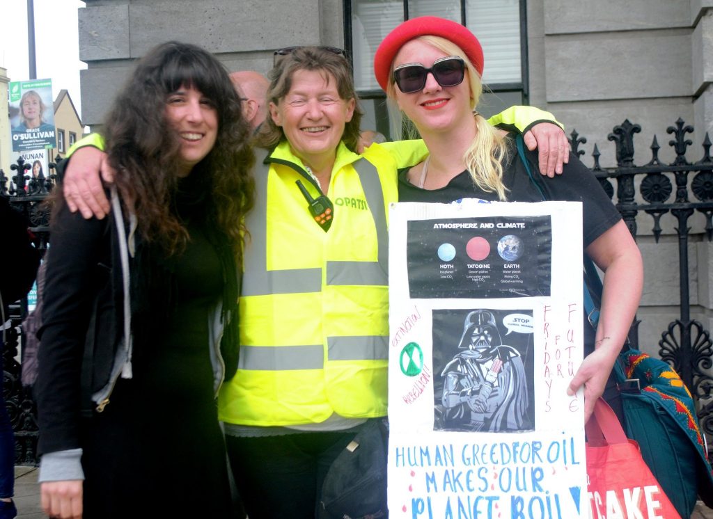 Tjitske de Vries (R) with Noreen Murphy (C) and Martina Evans (L) at a climate rally in Cork pic Shamim Malekmian