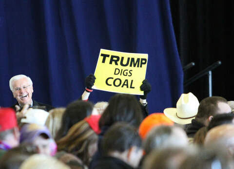 trump-digs-coal-sign-loui-c70aaa0be92c192d12dc87ad78e641d12cb262a4