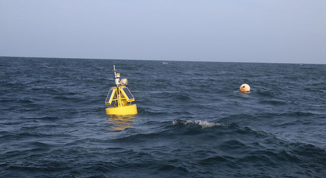 slide 3 - A buoy marks the West End CP mooring site south of Dauphin Island, Alabama, in the Gulf of Mexico